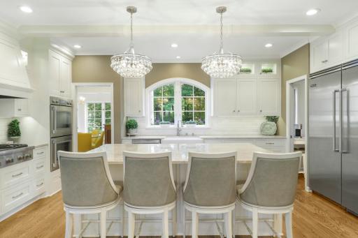 The newly remodeled, stunning, open concept, chefâs kitchen features Thermador and Viking appliances, in-cabinet lighting, a massive pantry with prep space and natural light, and a large center island with stool seating that opens to the dining room.