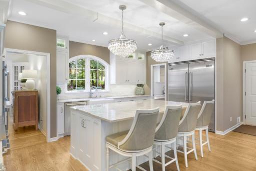 The newly remodeled, stunning, open concept, chefâs kitchen features Thermador and Viking appliances, in-cabinet lighting, a massive pantry with prep space and natural light, and a large center island with stool seating that opens to the dining room.