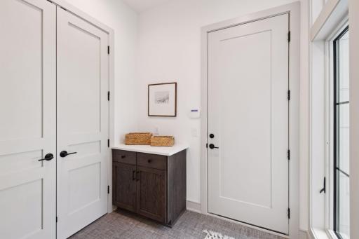 Mud room off Garage, additional mudroom option in heated garage.