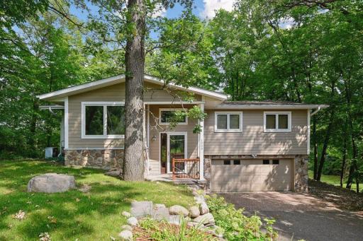 Great curb appeal with tons of mature trees!