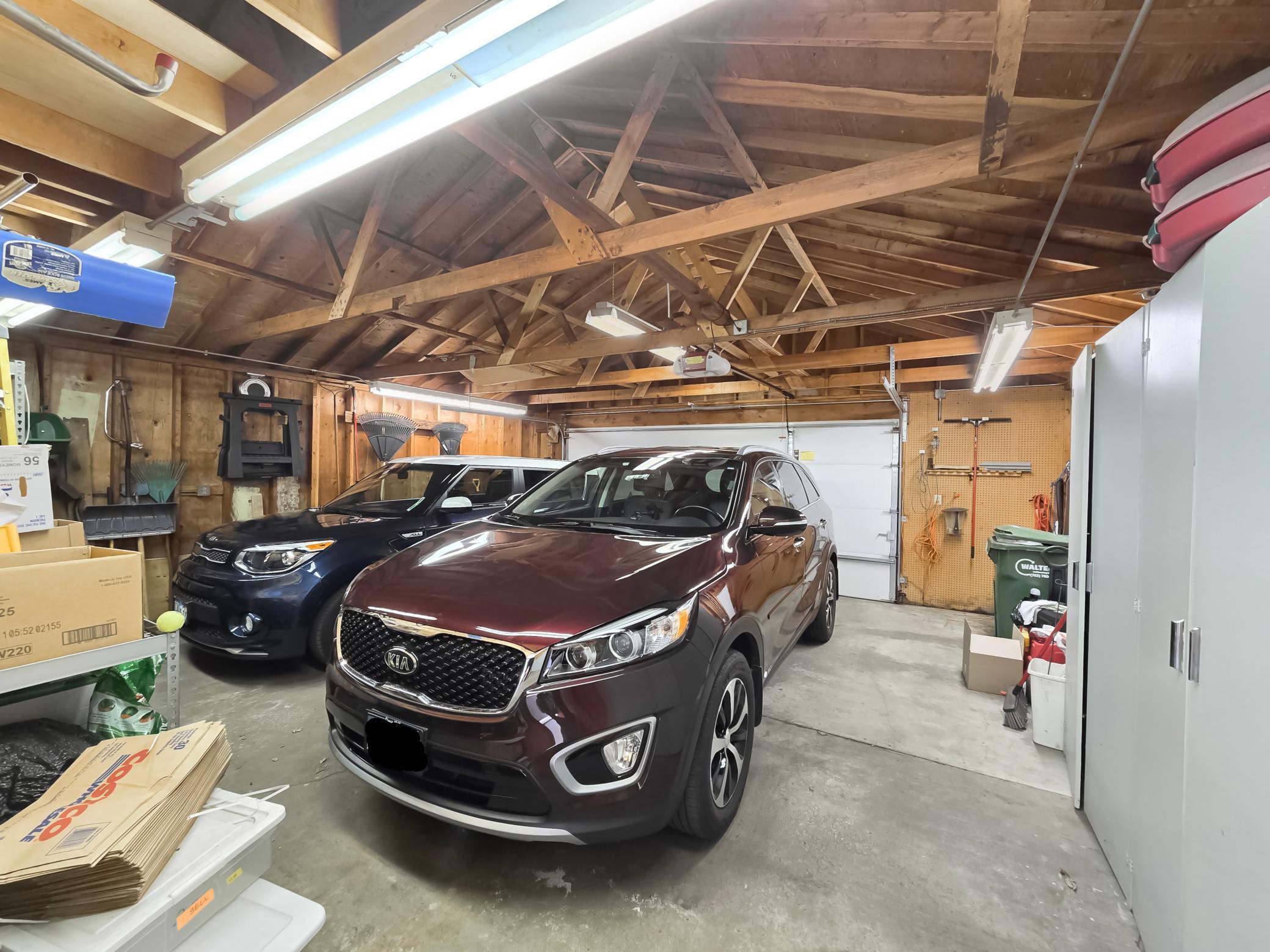 HUGE Garage, look at the space fit 2 large cars, storage closets on left & space in back!