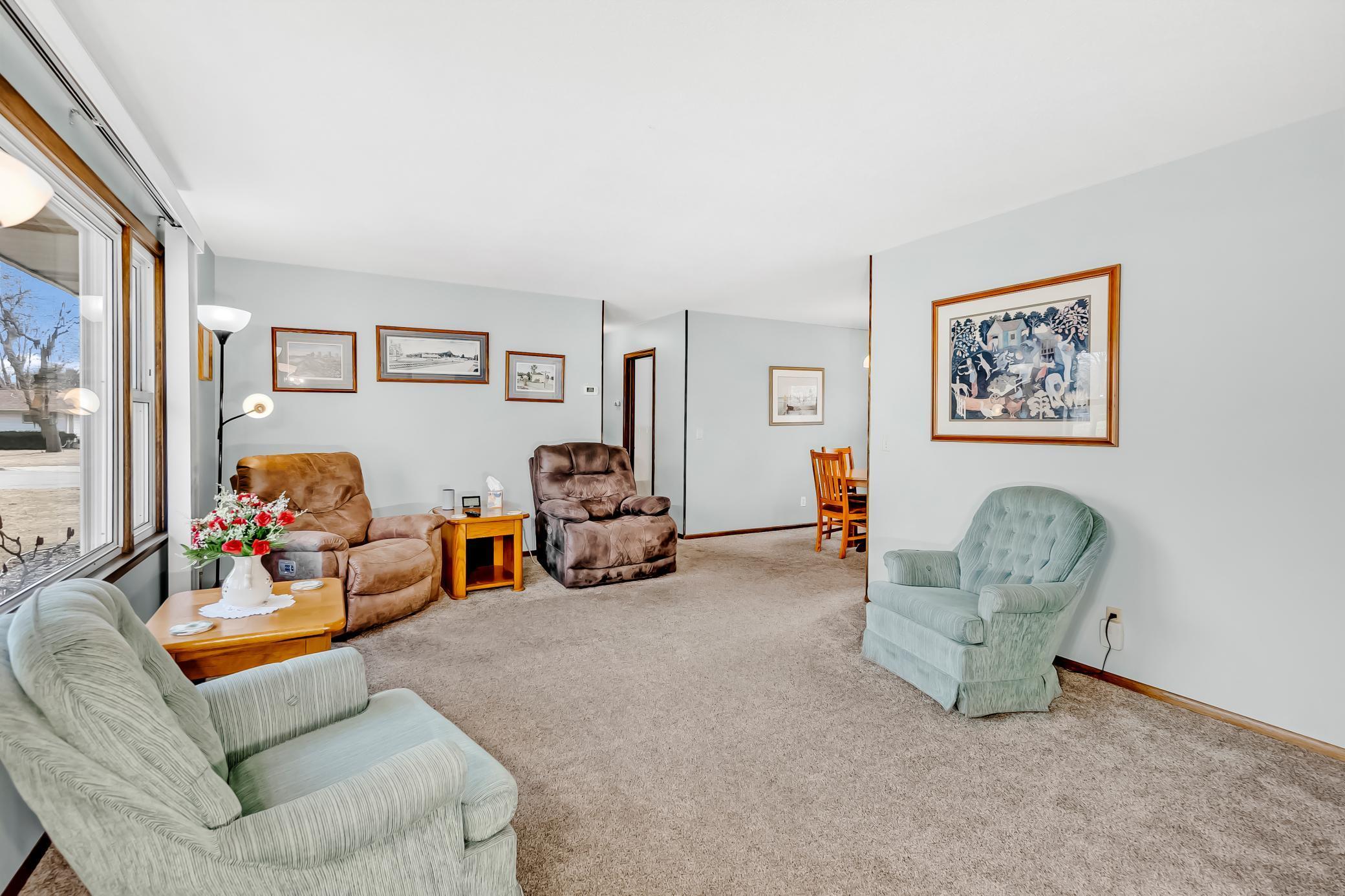 Spacious living room flows into dining area