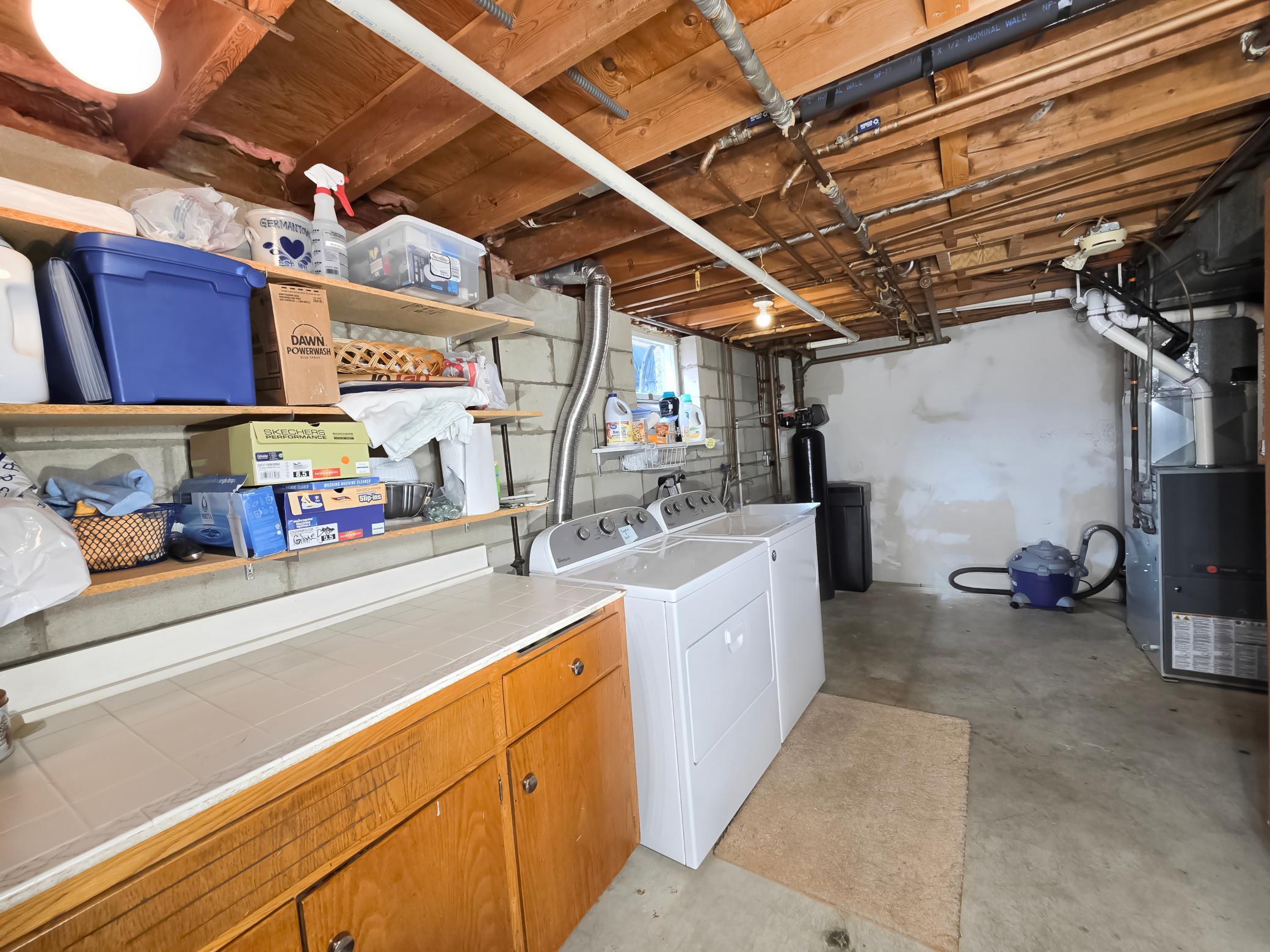 Large laundry room w/mechanicals & 1 of 2 cedar closets