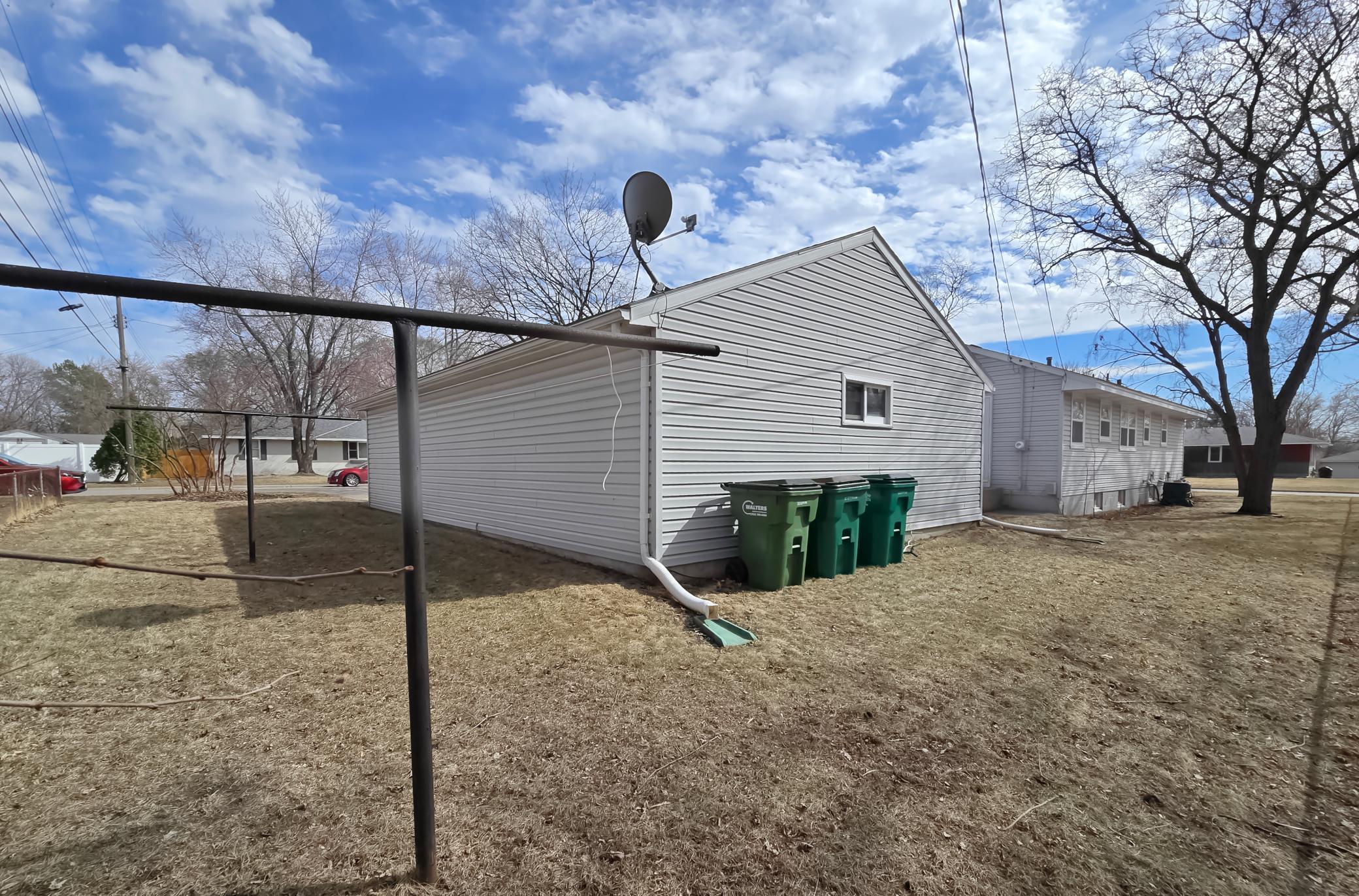 Side of garage has a laundry poles for hanging sheets to air dry, like the old days!