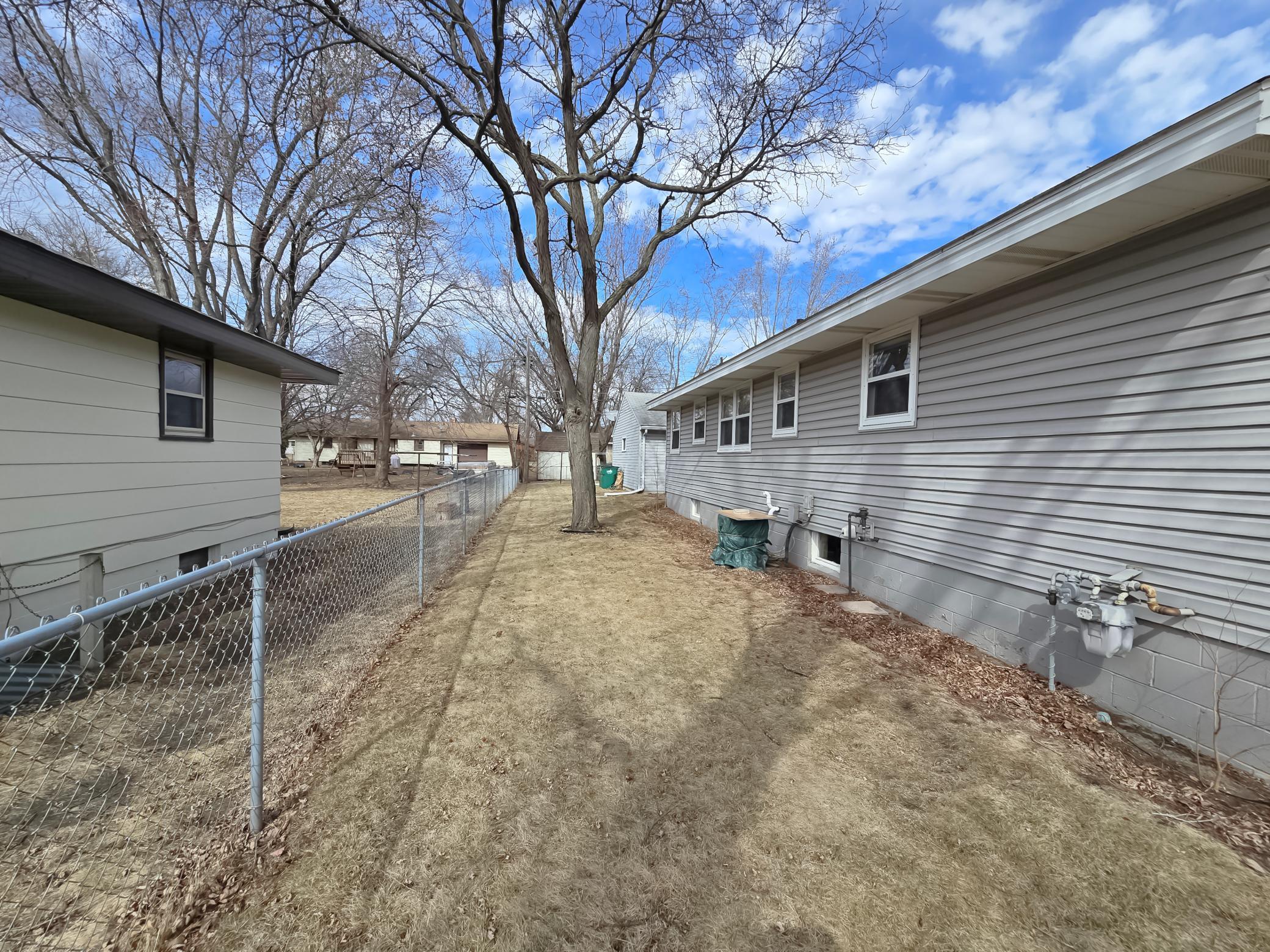 Back of house w/partial fence