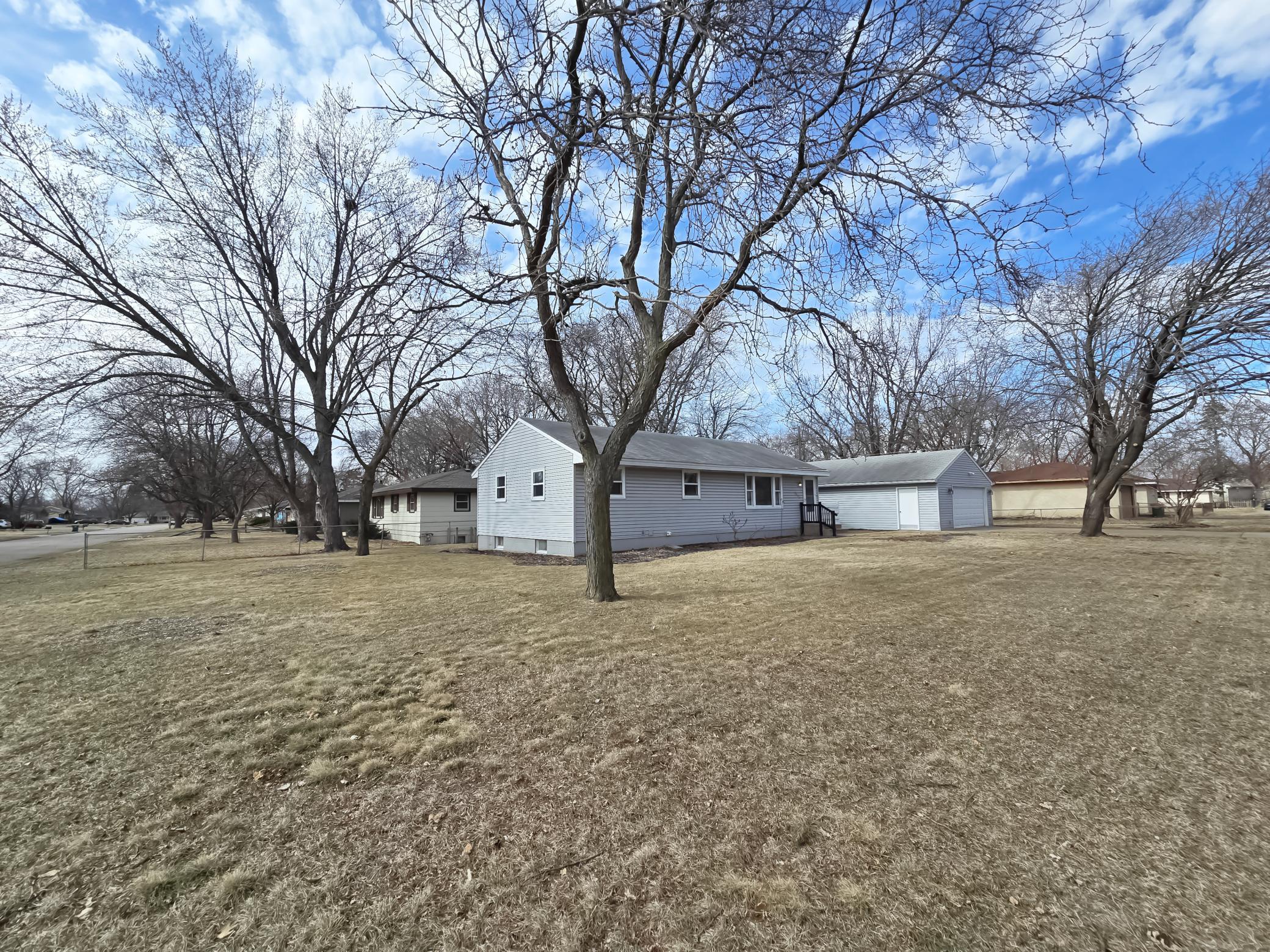 View of house & large yard from corner of the street
