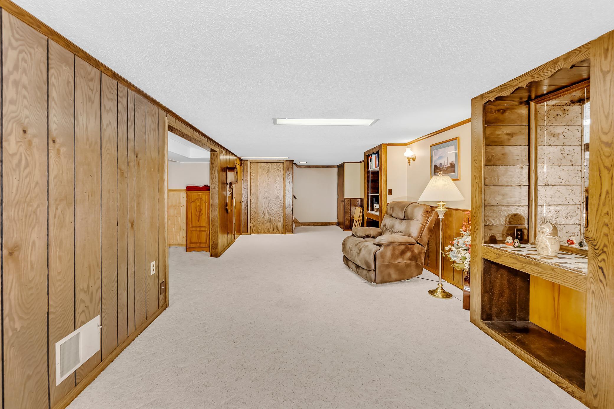 Check out this huge family room w/built-ins & cedar closet (plus small workshop behind flex room!