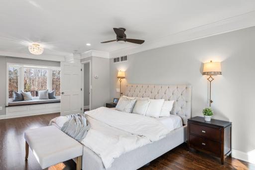 A few steps higher, the expansive primary suite awaits, designed as a true retreat.