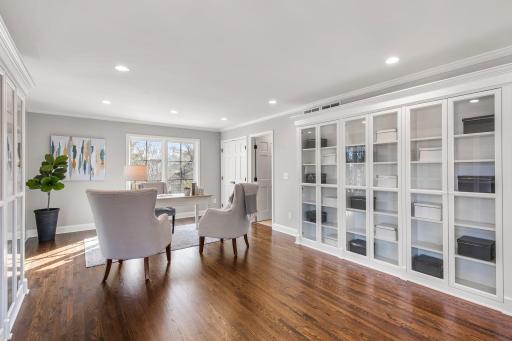It features built-in cabinetry along multiple walls and a built-in marble reading bench.