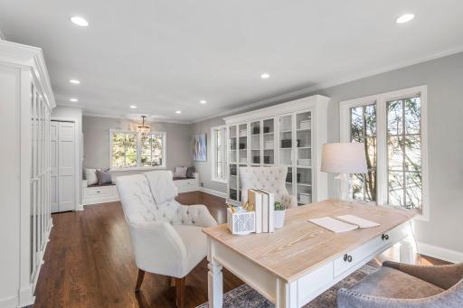 Across the hall from the primary suite, an expansive bonus room serves as a versatile space ideal for a fifth bedroom, recreation room, office, or study.