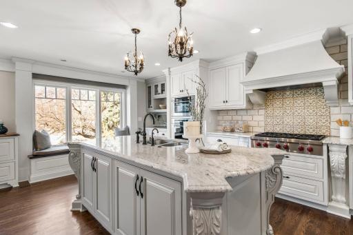 The kitchen is home to Wolf appliances with professional series range, Miele dishwasher and warming drawer and Sub-Zero refrigerator and freezer.