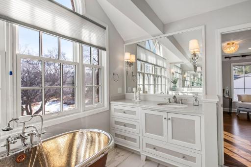 Heated tile flooring adds comfort, while the dual vanity offers ample space.