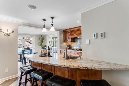 Adjacent to the family room, a secondary kitchen enhances convenience for entertaining.
