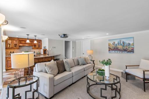 This inviting space boasts a wood built-in entertainment center and plush carpeting.