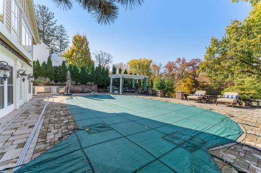 This home features a stunning heated in-ground pool, perfect for cooling off on hot days or enjoying leisurely swims.