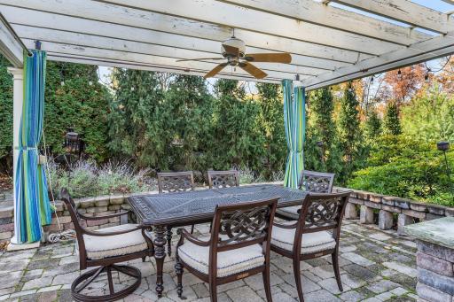 This inviting pergola is designed for comfort and relaxation, featuring a fan and UV Screens to keep the air cool and comfortable.