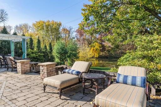 Enjoy tranquil views of the serene pond in the backyard, offering a peaceful and picturesque setting.