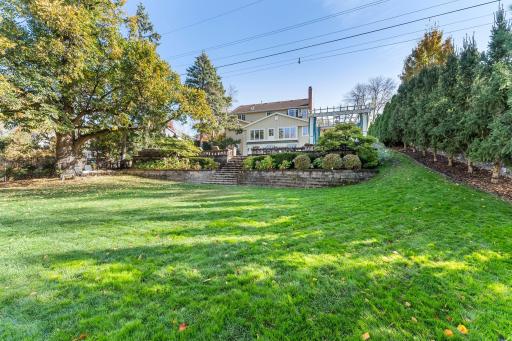 This expansive backyard, set on over half an acre, offers plenty of space for outdoor activities and relaxation.