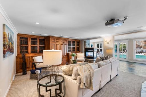 Continuing to the lower level, the home opens into a vast family room, designed for relaxation and entertainment.