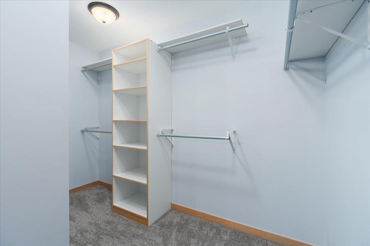Primary bedroom walk-in closet