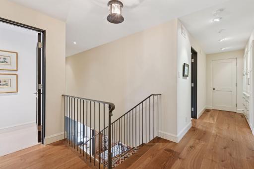 the bedroom level features ample hall cabinetry and generous closet spaces
