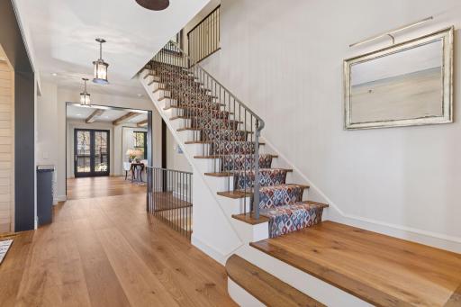 Wide-plank white oak flooring extends throughout the home