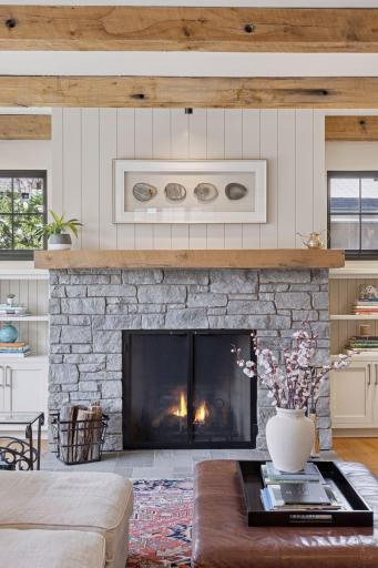 The cozy wood-burning fireplace is the heart of the main floor living space