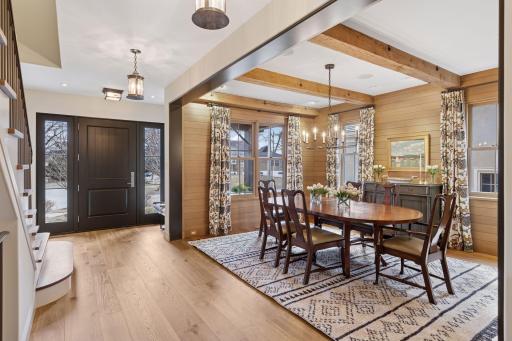 Thoughtfully placed white oak accent walls elevate the aesthetic, bringing warmth and texture to the modern design