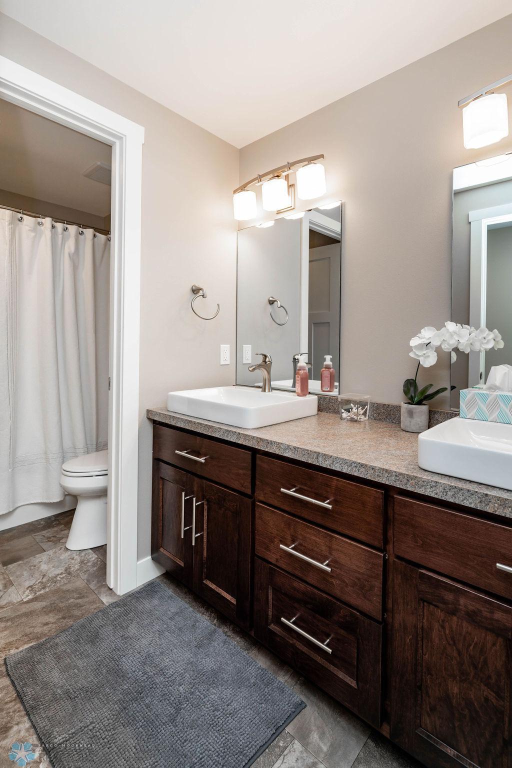 Basement Bath w/ Double Sinks and Privacy Door
