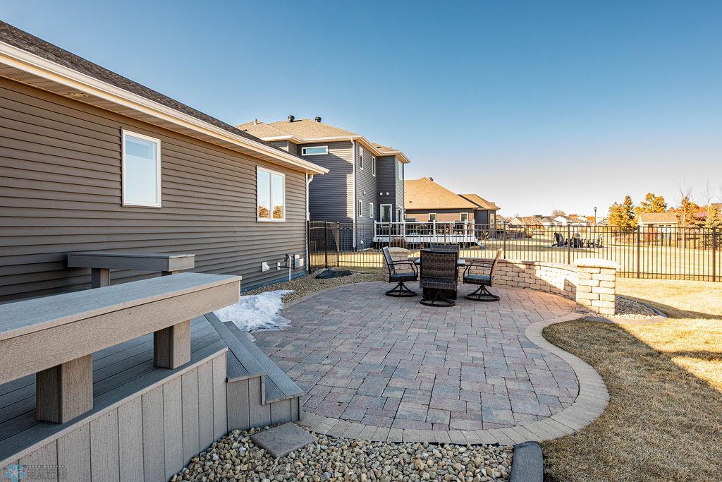 Wonderful large block patio to sit and enjoy your backyard.