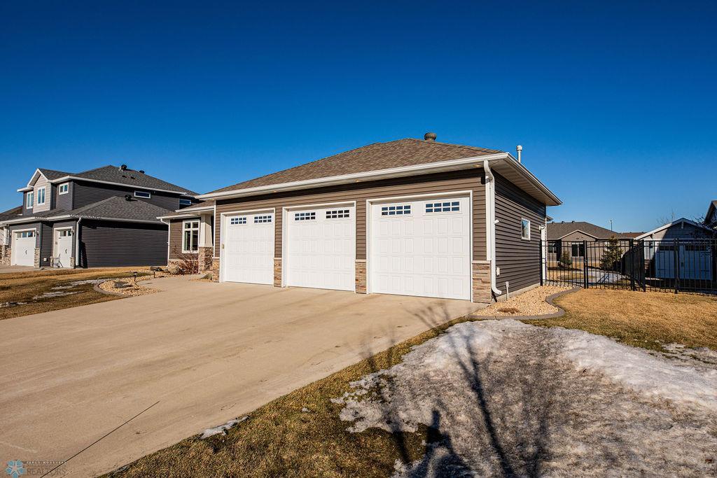 Plenty of Garage Space and Concrete for Parking