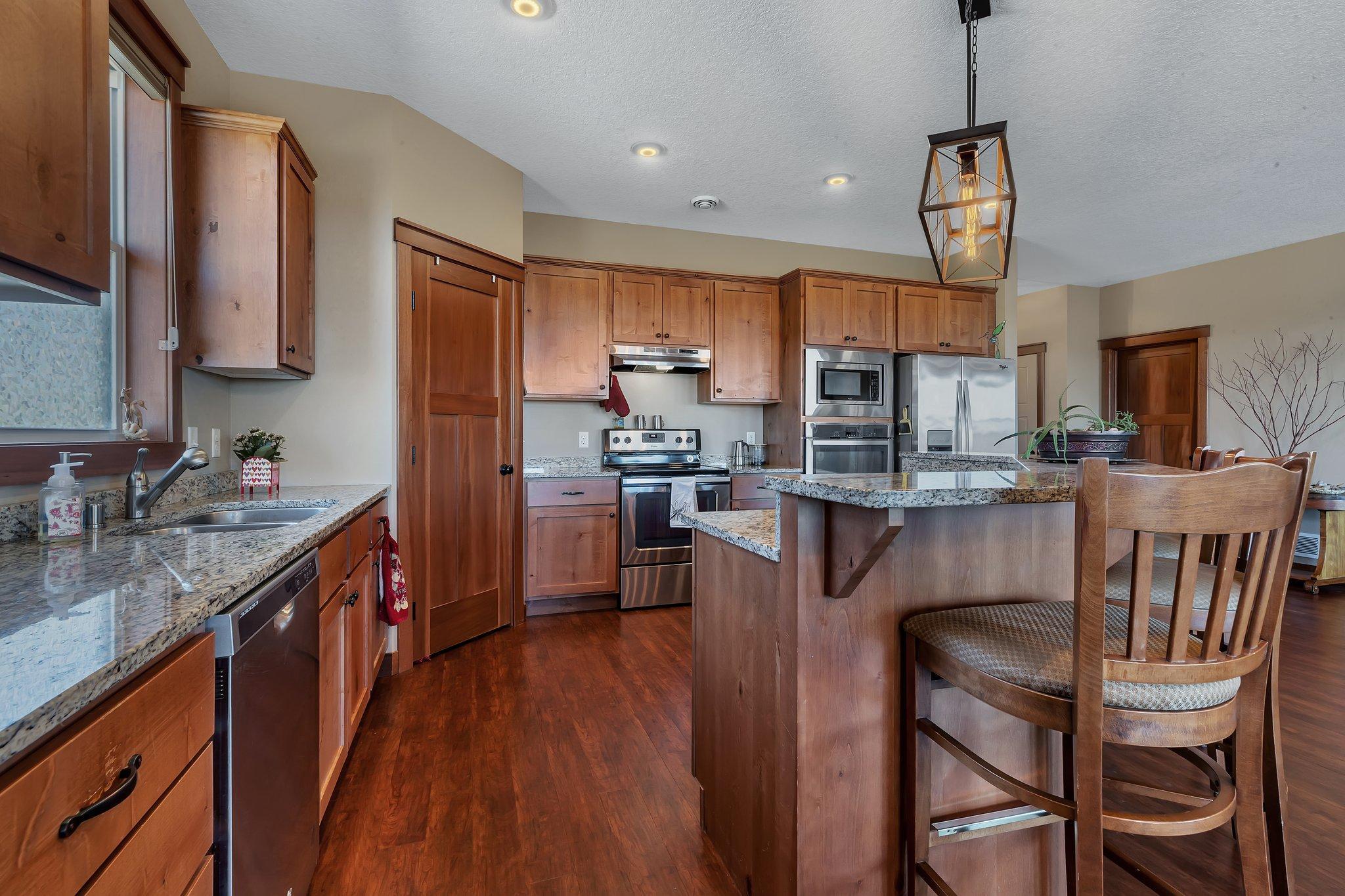 Ample cabinetry enhanced by a huge corner pantry.