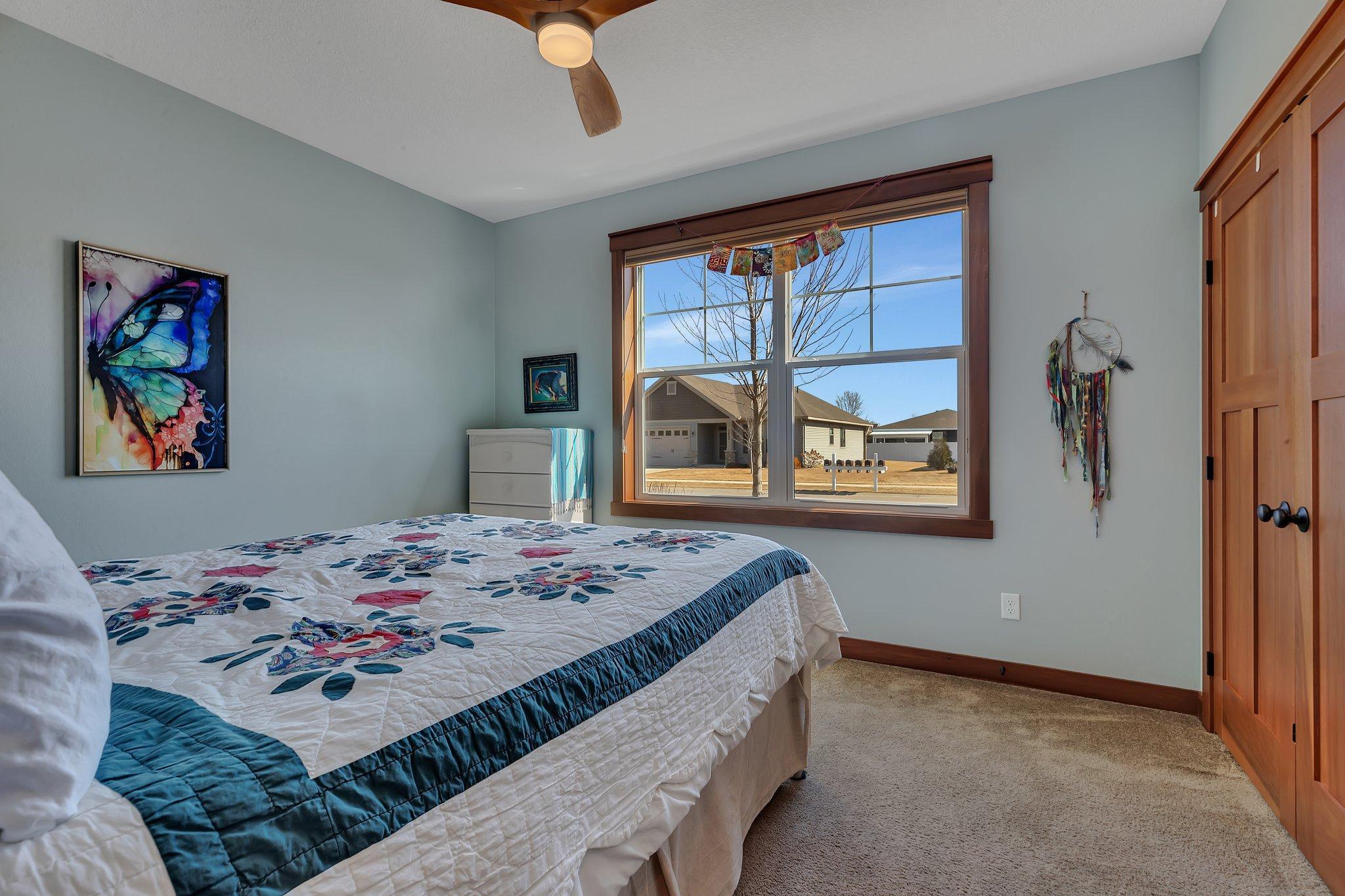 Generous sized bedroom situated with view of the front yard and functional with large closets.