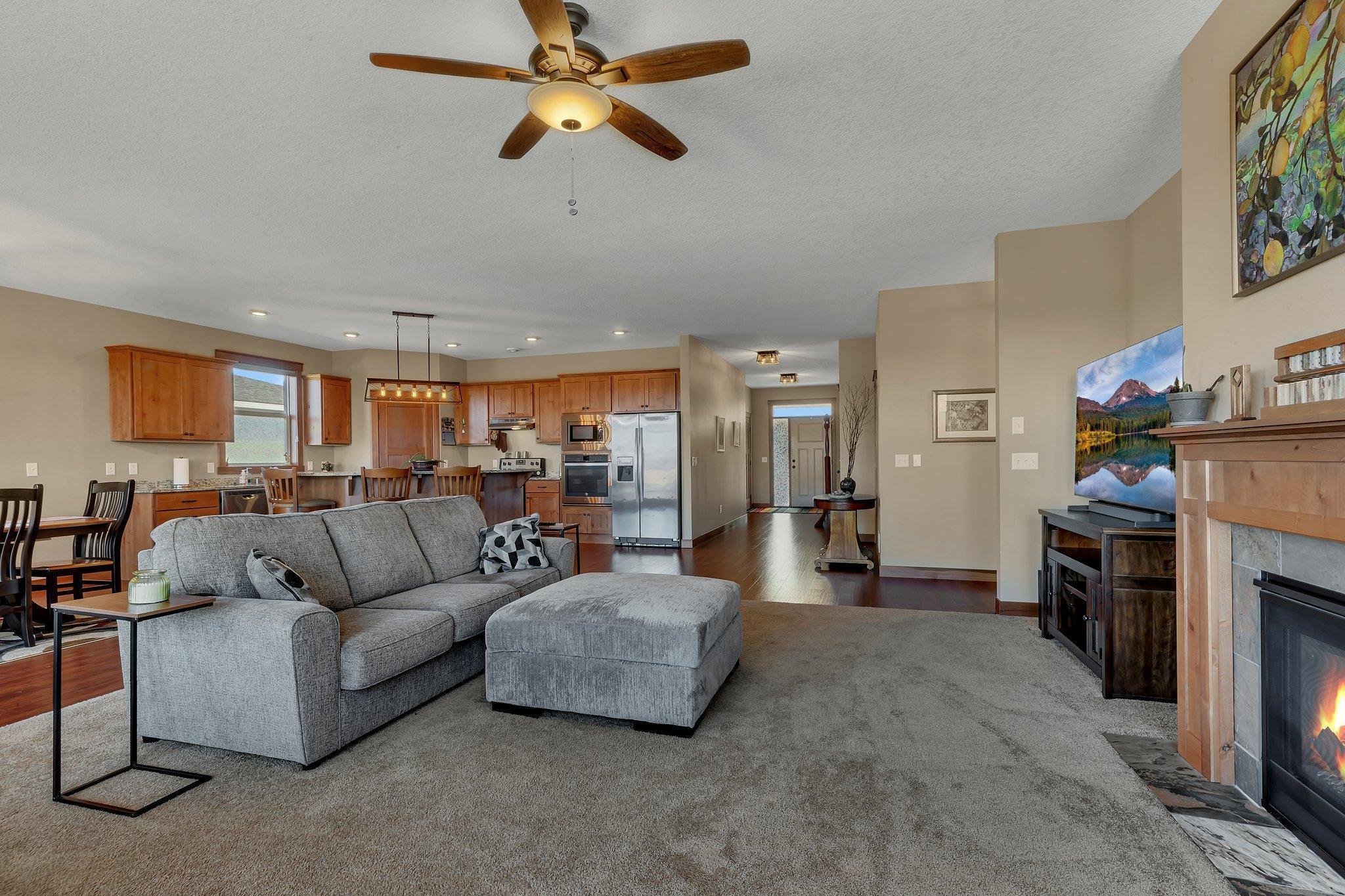 Perfect place to unwind or entertain, the living room is open to the kitchen and dining.