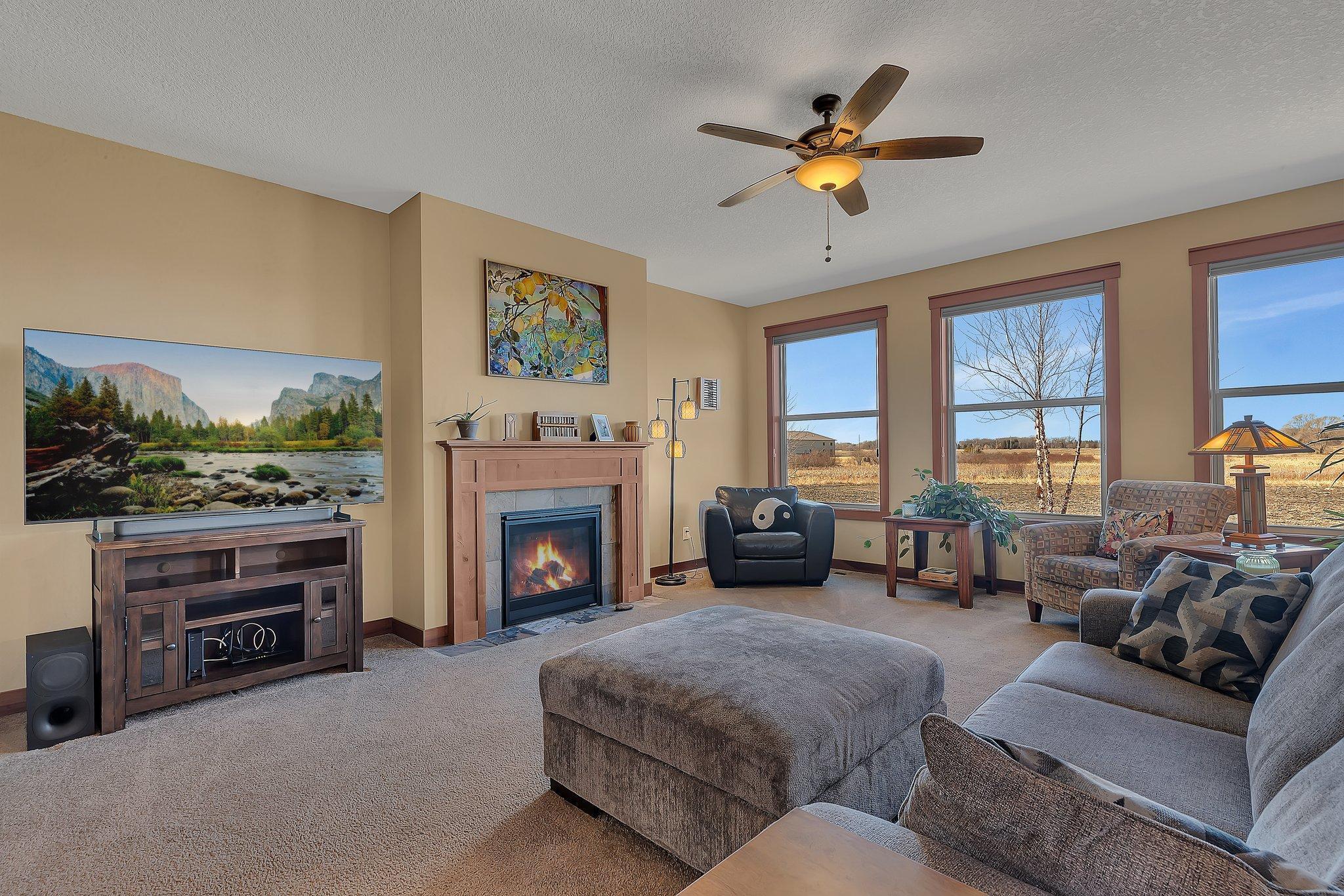 Fireplace is an elegant focal point in the living room.