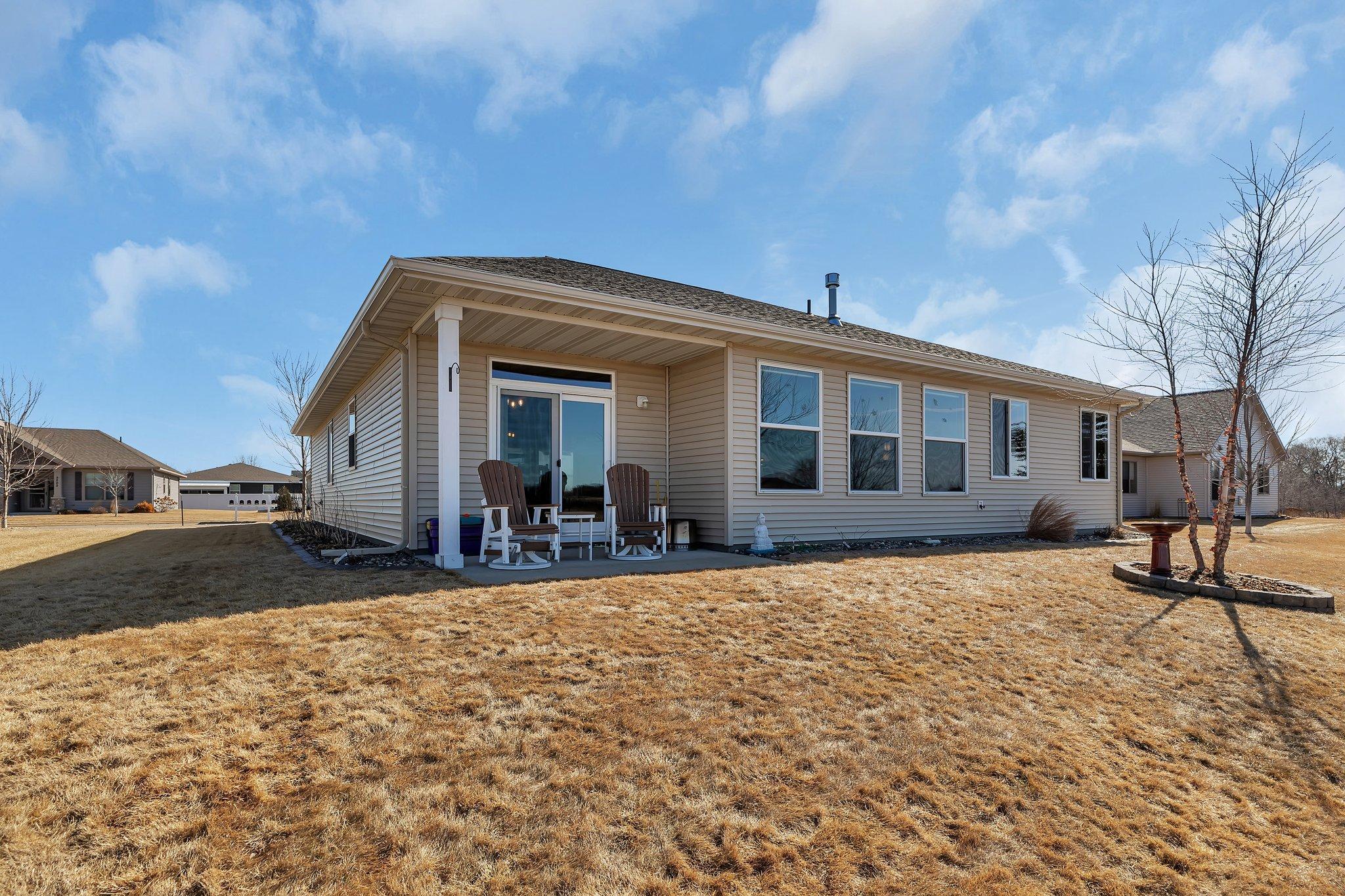 Back patio creates an outdoor living space.