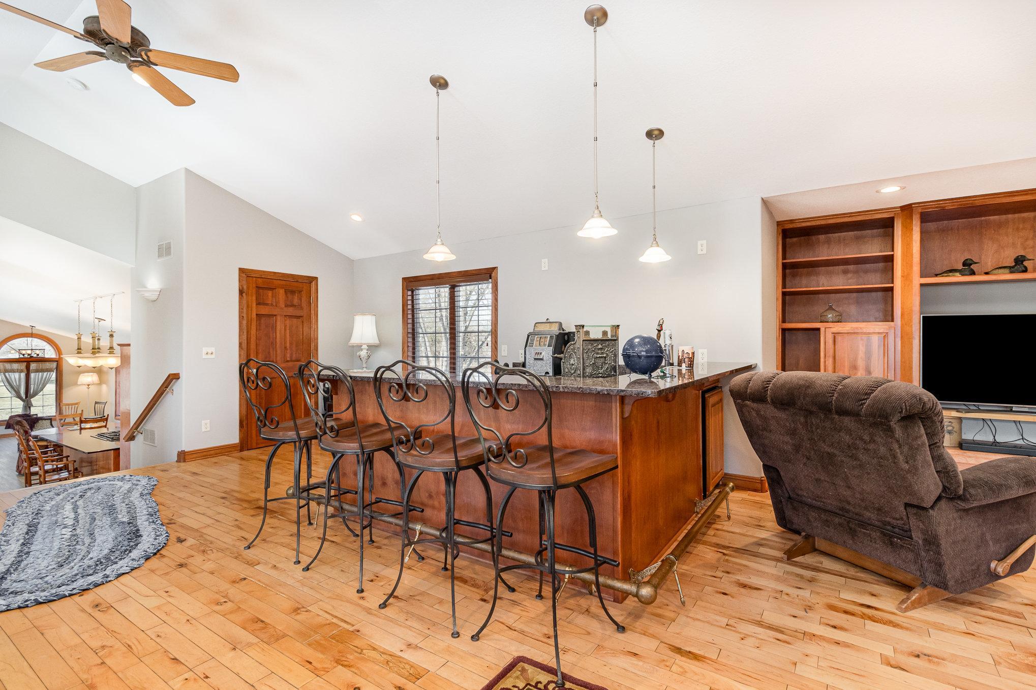 This open floor plan allows for easy access the kitchen and the main level of the home.
