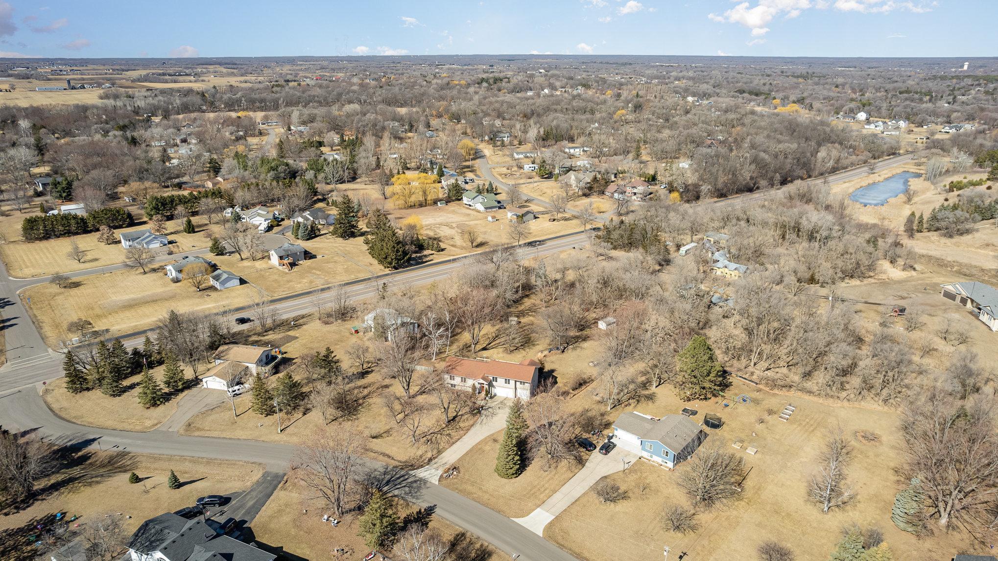 Aerial views of the property reveal a beautifully laid-out neighborhood with ample space between homes, ensuring a sense of privacy and tranquility.