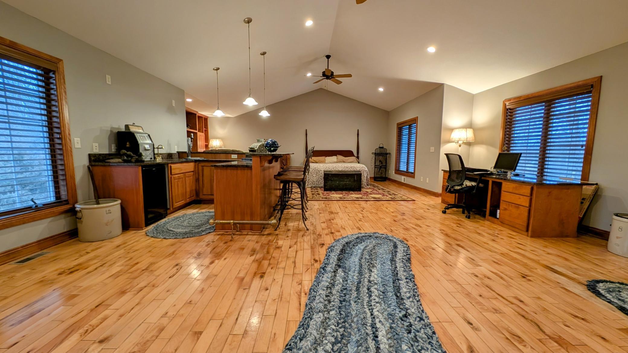 Versatile Upper-Level Living Space is currently being used as a master suite but could be used for entertainment, family room, the possibilities are endless...