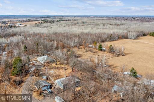 This image contains all the buildings on the property: House, garage, shed, chicken coop, horse barn w/4 stalls, grooming facility