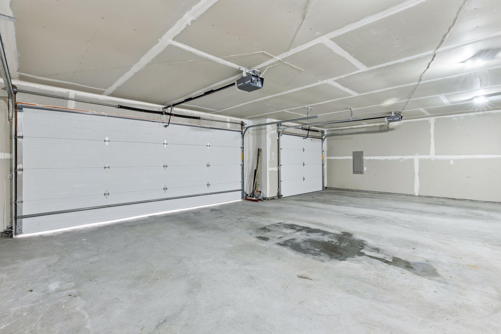 The enormous three-car garage in this home is more than just a place to park your vehicles. The finished walls add a polished touch, enhancing the overall look and feel of the space.
