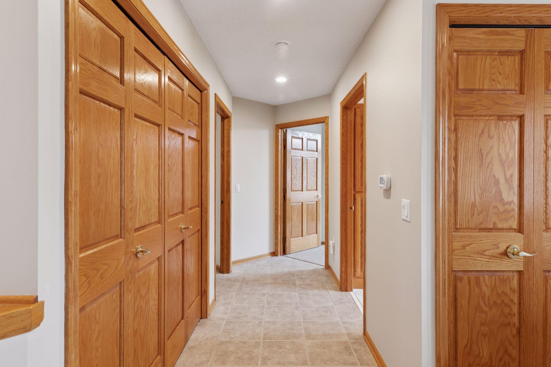 Really wide hallways, paneled oak doors, levered door handles and LED lighting.
