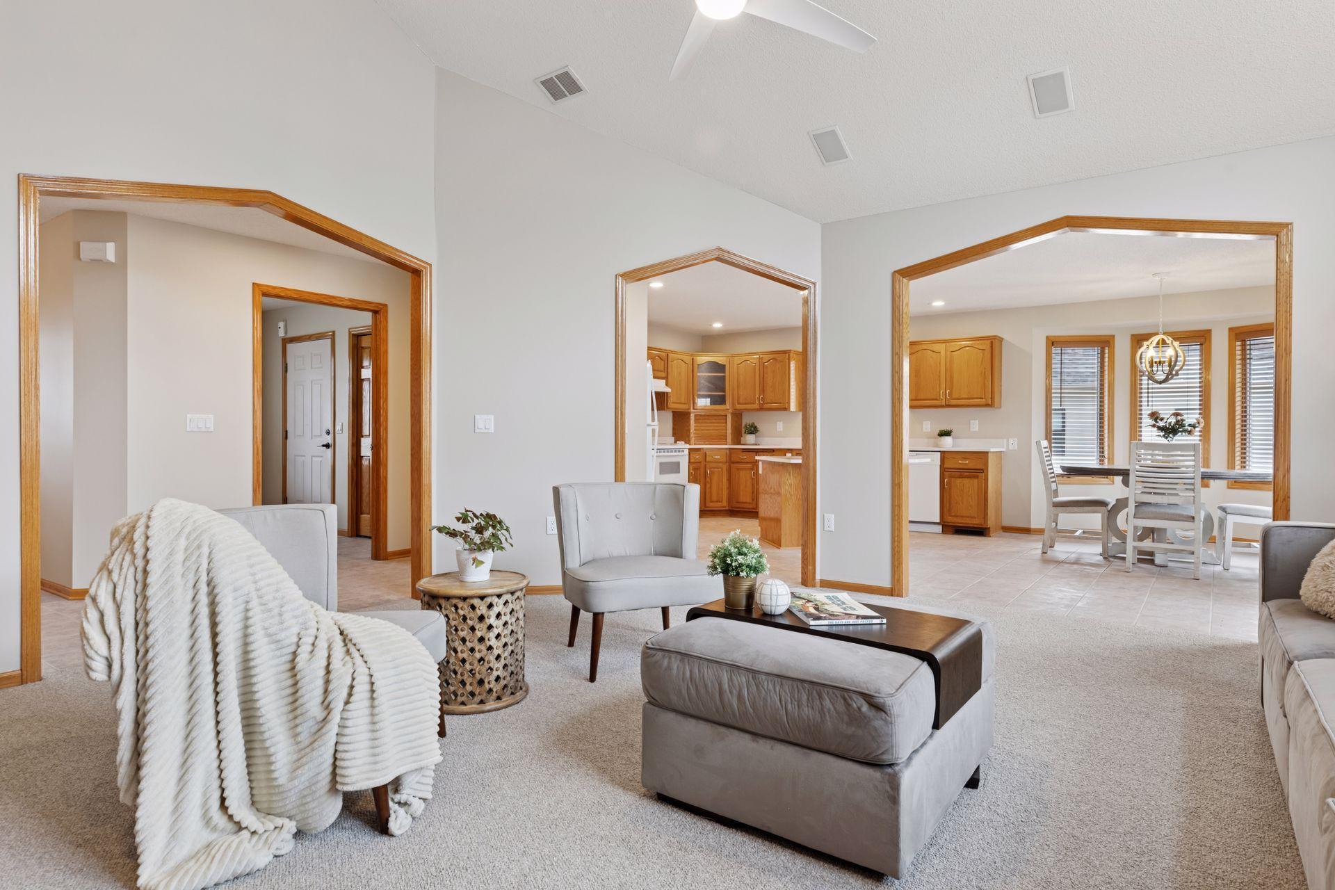 Plush new carpeting underfoot adds warmth and luxury, while the open layout provides beautiful views into the kitchen and dining areas—perfect for entertaining or everyday living.