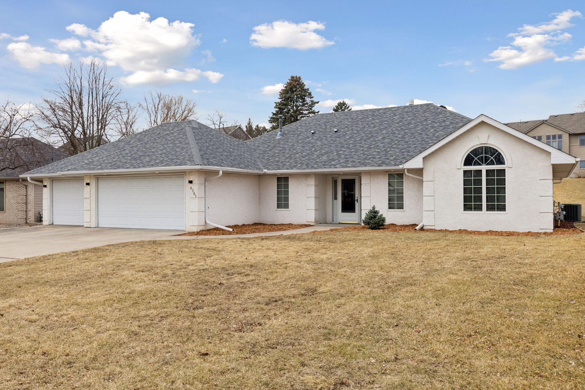 As evening falls, the exterior lighting beautifully illuminates the property, highlighting its architectural features and providing a welcoming glow.