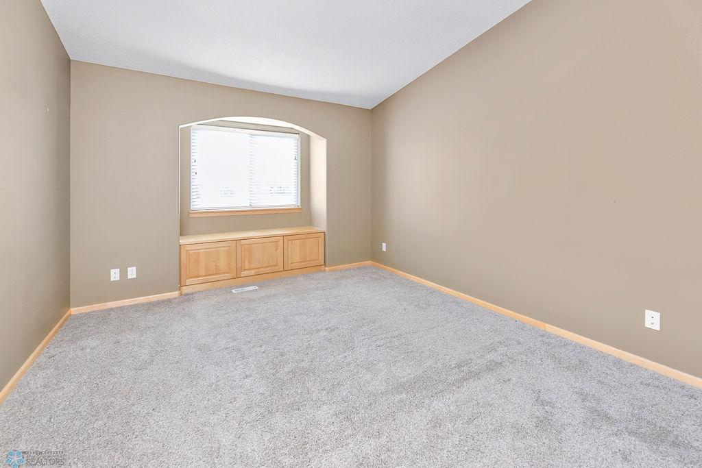 Primary bedroom w/ window seat storage