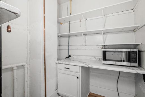 Off of the kitchen is a walk-in pantry with access to the basement.