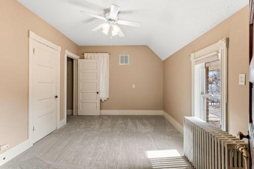 Primary bedroom on upper level features new carpet (2025)