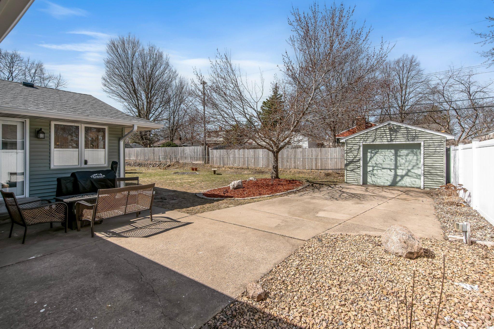 Head out back where you will find your additional 3rd garage! Fully fenced in yard too!