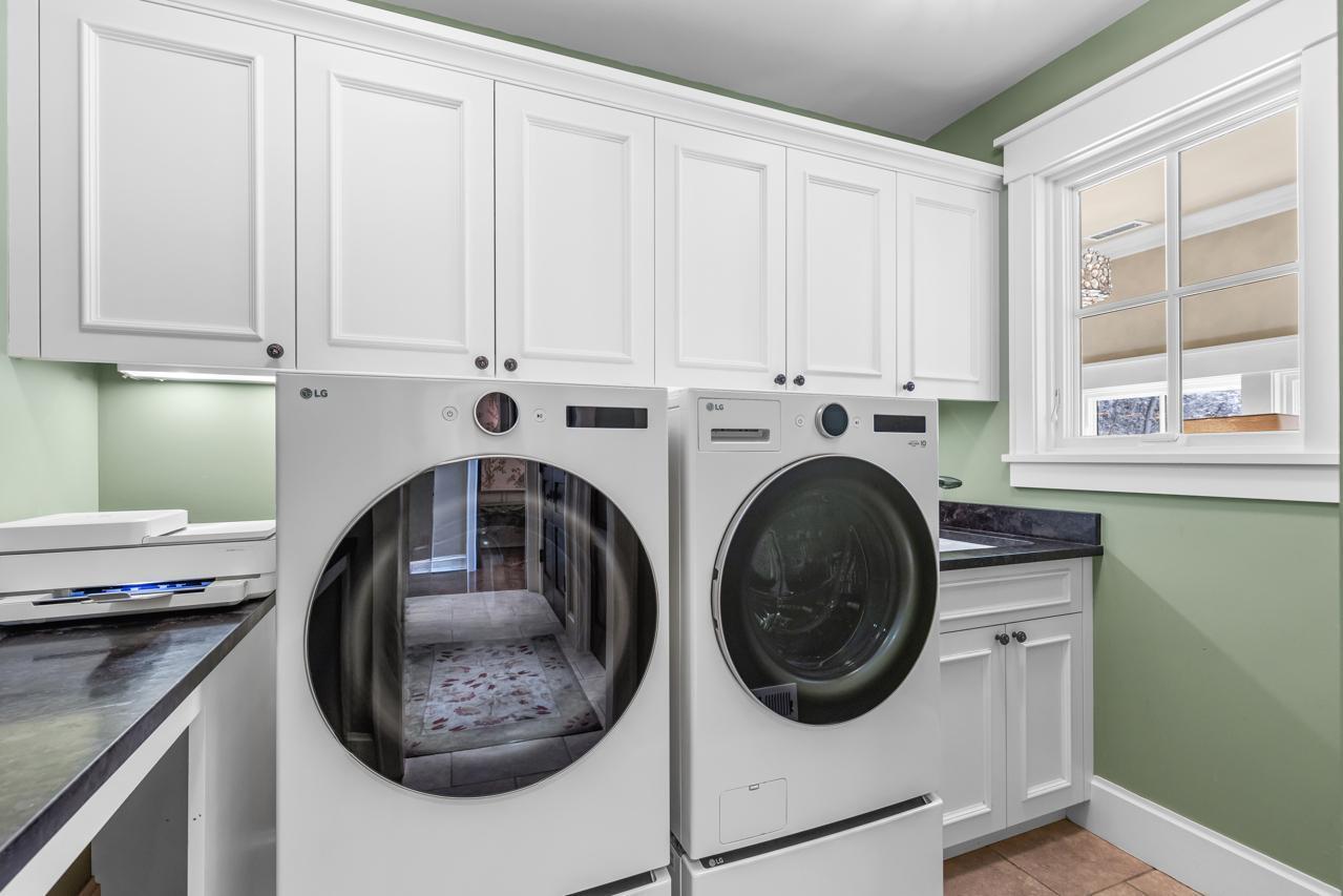 Separate Main Floor Laundry with newer washer and dryer