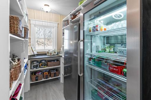 Walk In Pantry includes additional Refrigerator and Freezer plus a doggie door leading out to the dog run